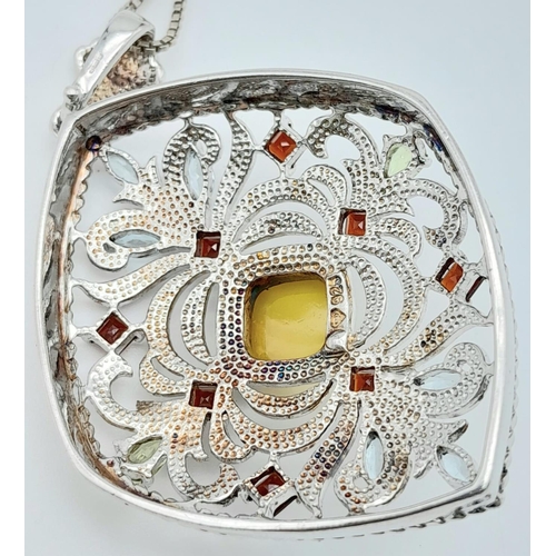 537 - AN IMPRESSIVE SILVER PENDANT DECORATED WITH COLOURFUL GEMSTONES ON A 50cms SILVER CHAIN.  9.8gms