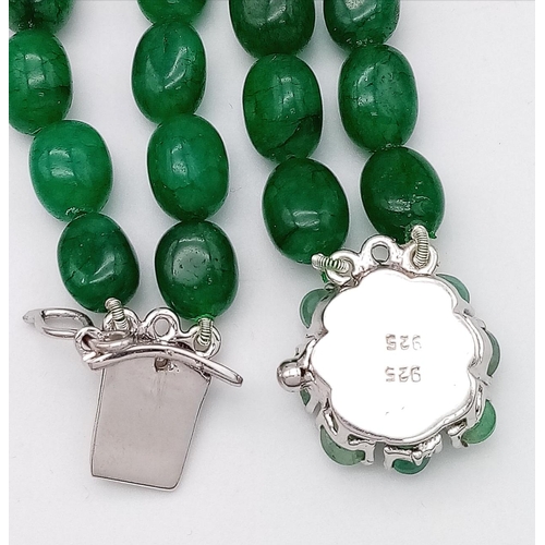 59 - A Two Strand Emerald Oval Beaded Necklace. With a matching gemstone and Silver Clasp. Beads-422ctw. ... 