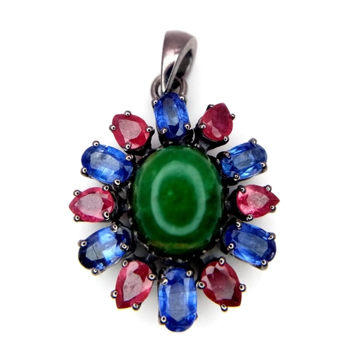 824 - An Emerald Silver Pendant with Rubies & Kyanites. Oval cut Emeralds set in 925 Sterling silver. 13.3... 