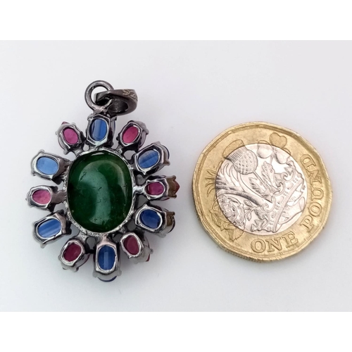 824 - An Emerald Silver Pendant with Rubies & Kyanites. Oval cut Emeralds set in 925 Sterling silver. 13.3... 