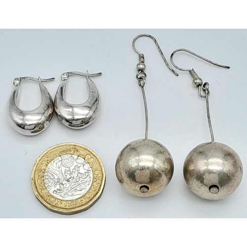 1002 - 2 PAIRS OF LARGE SILVER EARRIMGS.  8.8gms