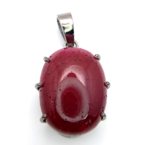 1021 - A Ruby Silver Pendant. Oval cut set in 925 Sterling silver. 57ctw. W-15.5g. 4cm. Ref: VO-1953. Comes... 