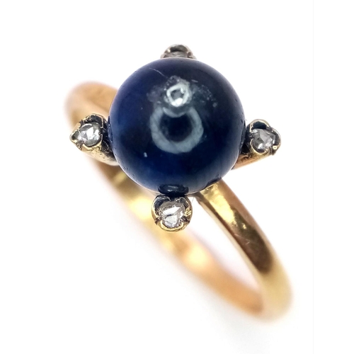 1183 - AN ANTIQUE 22K ROSE GOLD RING WITH SAPPHIRE BALL SURROUNDED BY DIAMONDS .   4.9gms   size T