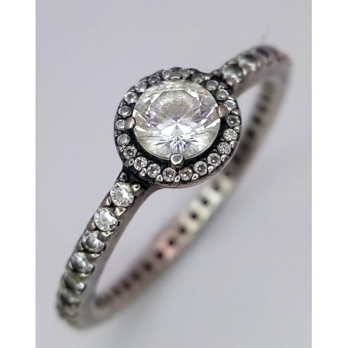 1339 - A fancy 925 silver Pandora Zirconia solitaire ring with full eternity round CZ. Total weight 2.35G. ... 