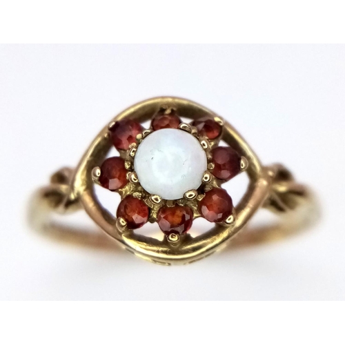 1431 - A 9K YELLOW GOLD GARNET & OPAL CLUSTER RING. 1.2G. SIZE J