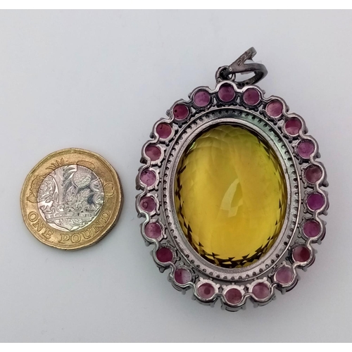 446 - A Citrine and Ruby Silver Pendant with Rose Cut Diamonds set in 925 Sterling Silver. Oval cut Citrin... 