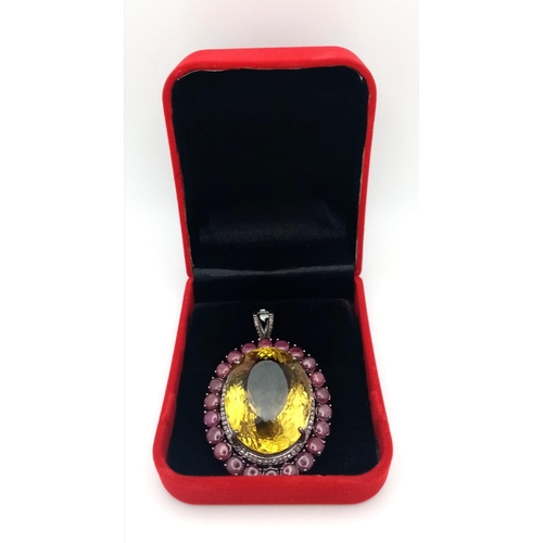 446 - A Citrine and Ruby Silver Pendant with Rose Cut Diamonds set in 925 Sterling Silver. Oval cut Citrin... 