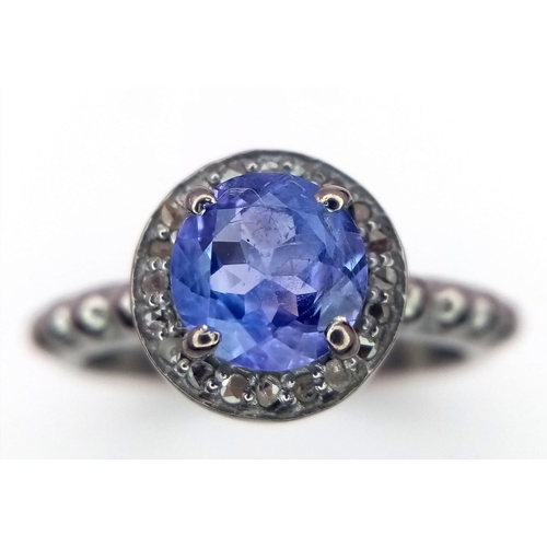 66 - A Tanzanite with Rose cut Diamonds Ring set in 925 Sterling silver. Tanzanite-1.5ct. Diamonds -0.22c... 