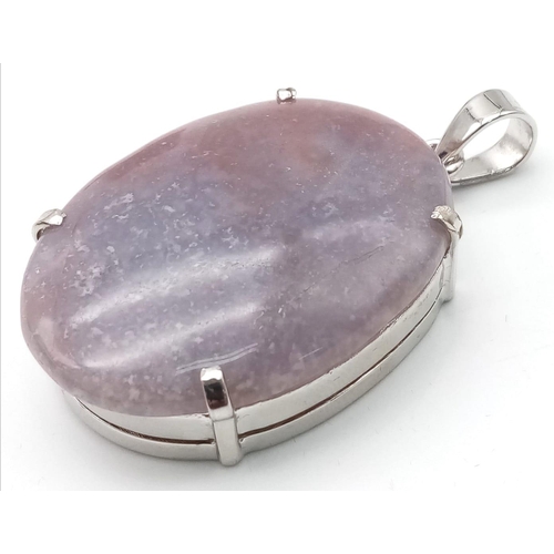 831 - An Oval Cut Corundum Agate set in 925 Silver Pendant. 70ct. W-26.80g. 6cm. Comes with a presentation... 