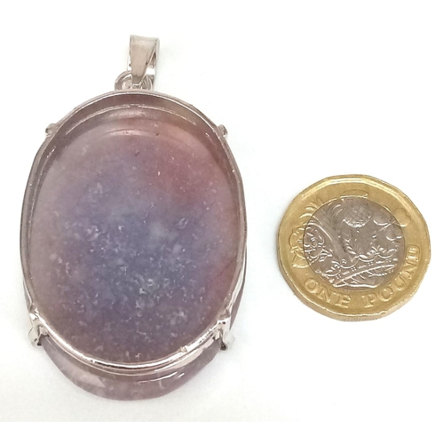 831 - An Oval Cut Corundum Agate set in 925 Silver Pendant. 70ct. W-26.80g. 6cm. Comes with a presentation... 