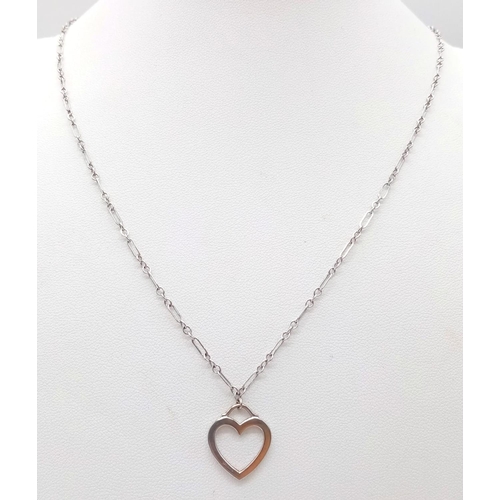 1204 - A GENUINE TIFFANY&CO 18K WHITE GOLD HEART PENDANT ON A 50cms 18K GOLD TIFFANY CHAIN .  6.3gms