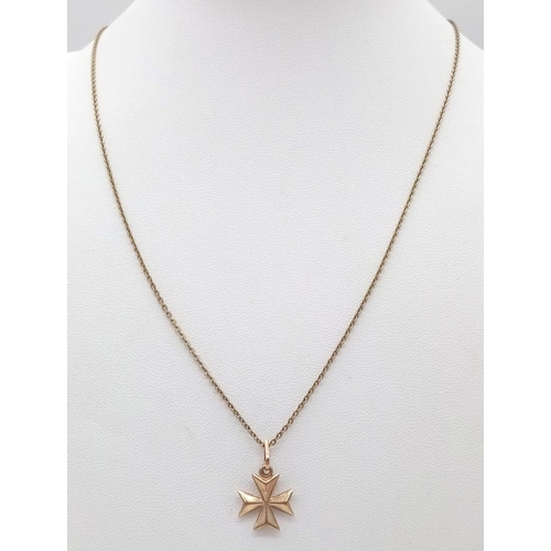 506 - A 9K GOLD MALTESE CROSS ON A 46cms 9K GOLD CHAIN .  2.1gms