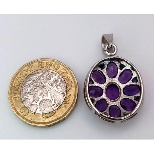 723 - An Amethyst Floral Pendant. Oval cut Amethysts set in 925 Sterling silver. 8ctw. W-5.3g. Ref: HV-200... 