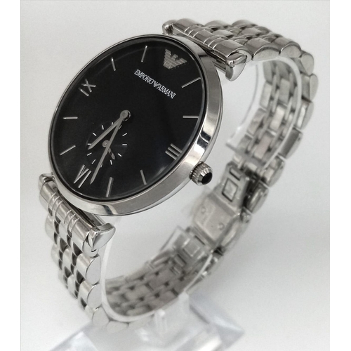 1239 - An Emporio Armani Gents Watch. Stainless steel bracelet and case - 40mm. Black dial with second dial... 