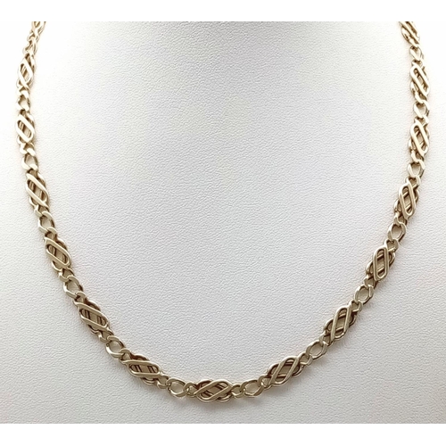 150 - A 9k yellow gold fancy link chain. 17