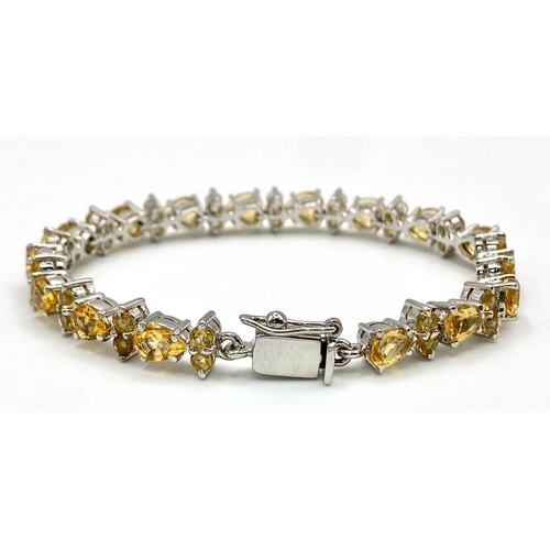 275 - A Citrine Tennis Bracelet set in 925 Sterling silver. 27ctw. W-21.6g. 18cm. Ref: VO-83