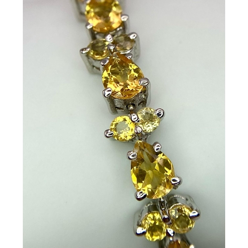 275 - A Citrine Tennis Bracelet set in 925 Sterling silver. 27ctw. W-21.6g. 18cm. Ref: VO-83