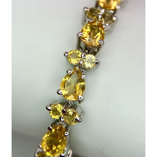 275 - A Citrine Tennis Bracelet set in 925 Sterling silver. 27ctw. W-21.6g. 18cm. Ref: VO-83