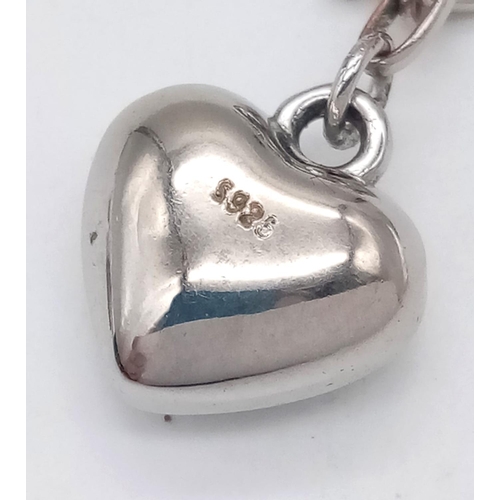 758 - A vintage 925 silver heart pendant on silver T-bar chain. Total weight 11.6G. Total length 48cm.