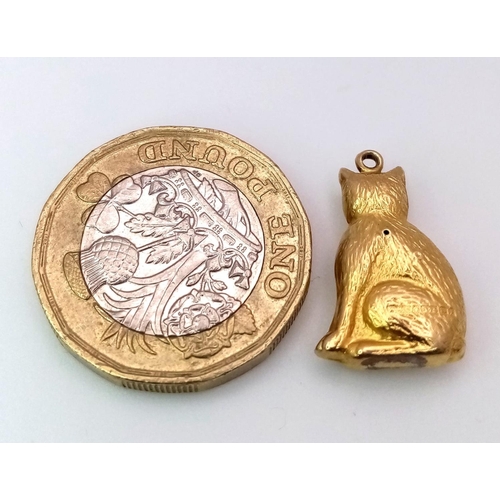 1320 - A 9K YELLOW GOLD PUSSY CAT CHARM. 0.9G.