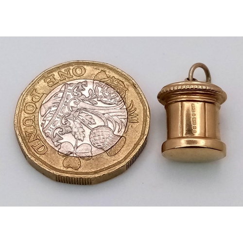 1377 - A 9K YELLOW GOLD POST BOX CHARM. 1.1G