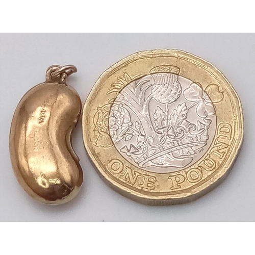 1432 - A 9K YELLOW GOLD BEAN CHARM. 0.9G