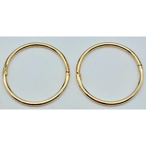 1451 - A 9K YELLOW GOLD MINI SLEEPER HOOP EARRINGS. 0.8G