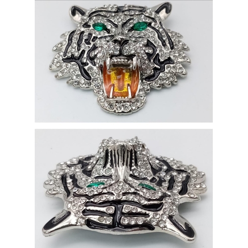 1500 - A Parcel of Two Stone Set Brooches; Comprising: 1) A Clear and Emerald Green Stone Set Tiger Head Br... 