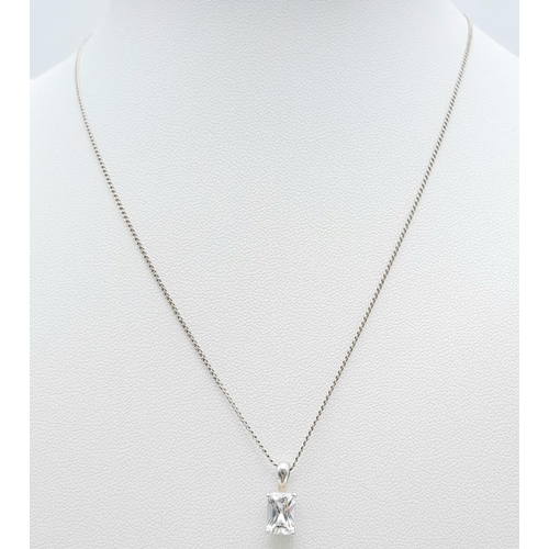 995 - A fancy 925 silver Zirconia pendant on silver delicate chain. Total weight 2.1G. Total length 40cm.