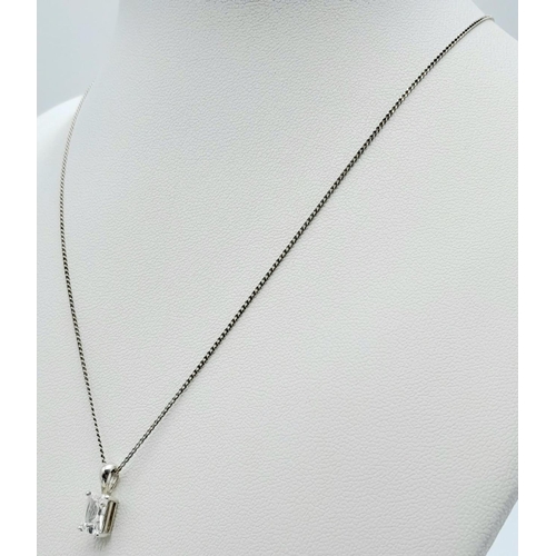 995 - A fancy 925 silver Zirconia pendant on silver delicate chain. Total weight 2.1G. Total length 40cm.