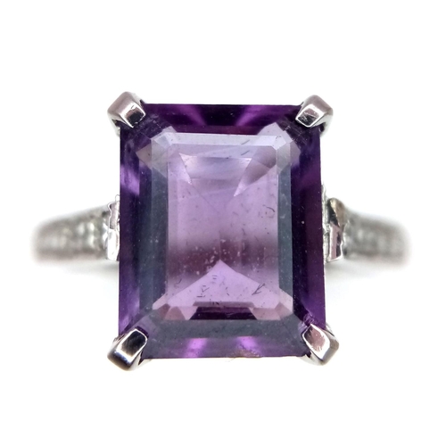 298 - A 14K WHITE GOLD DIAMOND & AMETHYST RING. 4.2G. SIZE N.