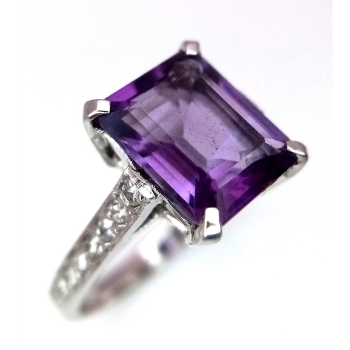 298 - A 14K WHITE GOLD DIAMOND & AMETHYST RING. 4.2G. SIZE N.