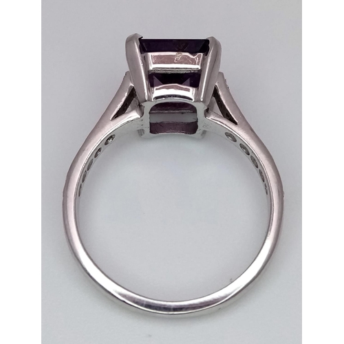 298 - A 14K WHITE GOLD DIAMOND & AMETHYST RING. 4.2G. SIZE N.