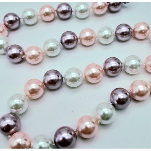 734 - A South Sea Pearl Shell Pastel Coloured Bead Necklace. 12mm beads. 44cm necklace length.