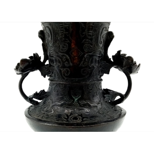 742 - An Antique 18th Century Chinese Bronze Gu Vase Decorated in Low Relief with Rolling Waves and Flamin... 