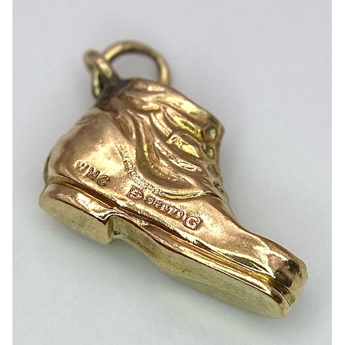 1298 - A 9k yellow gold boot charm. 0.6g