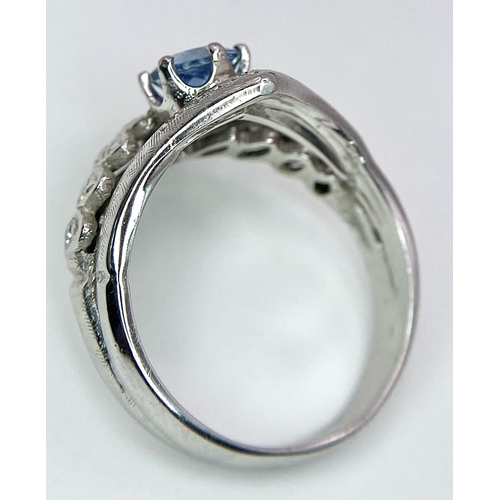 555 - A 14K WHITE GOLD DIAMOND & BLUE TOPAZ RING - 6.2G. SIZE Q