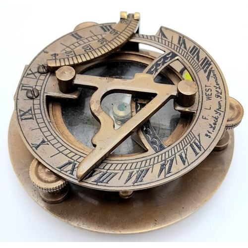 841 - A Portable Folding Bronze Sundial/Compass in its own Wooden Presentation Case. 7.5cm. In good condit... 