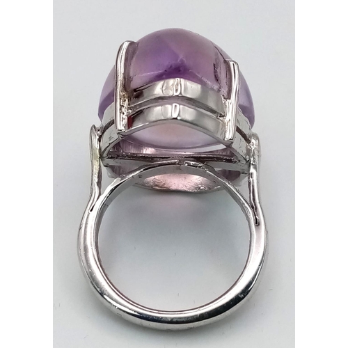 162 - An Amethyst Cabochon 925 Silver Ring. 45ct. W-16g. Size P/Q. Comes with a presentation case. Ref: VO... 