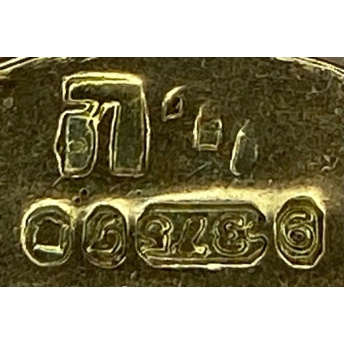 724 - A 9K yellow gold opening house charm. 2.7g