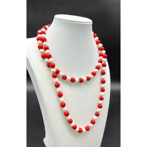 937 - A Matinee Length Red Coral and Cultured Pearl Necklace. 7/8mm pearls and beads. 88cm length.