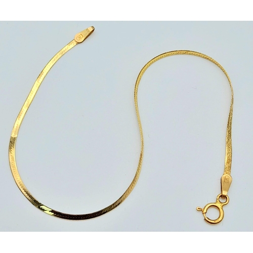 1447 - A Wafer-Thin 9K Yellow Gold Herringbone Bracelet. 17cm. 1g weight.