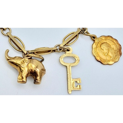 94 - A 9K Yellow Gold Charm Bracelet. Eight charms including Elephant! 10.65g weight.