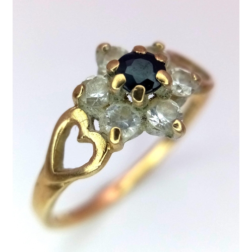 1449 - A Sapphire and Zirconia Decorative Floral Love Ring. Central sapphire with CZ halo. Size L. 1.47g we... 