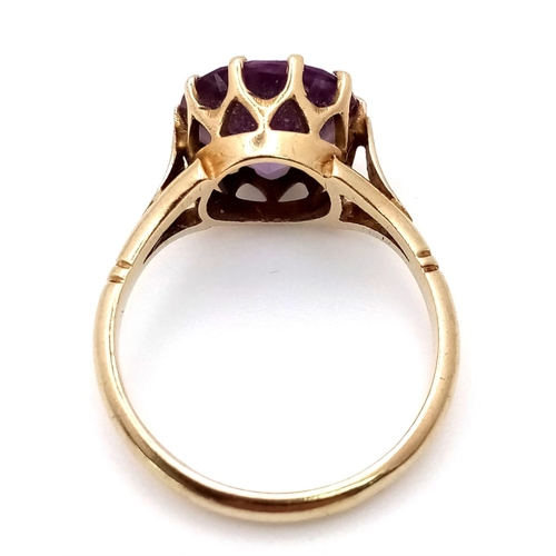 1453 - A Vintage 9K Yellow Gold Amethyst Ring. Round cut amethyst. Size M. 3.05g weight.