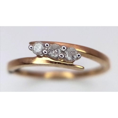 1458 - A 9K Yellow Gold Diamond Crossover Ring. 0.10ctw. Size L. 1.4g weight.