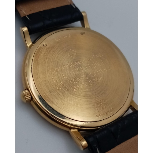 24 - A Longine 18K Gold Cased Gents Watch. Black leather strap. 18k gold case - 33mm. Gilded dial with da... 