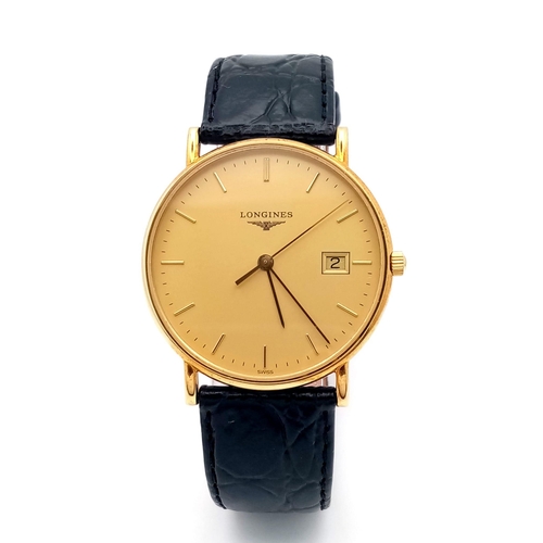 24 - A Longine 18K Gold Cased Gents Watch. Black leather strap. 18k gold case - 33mm. Gilded dial with da... 