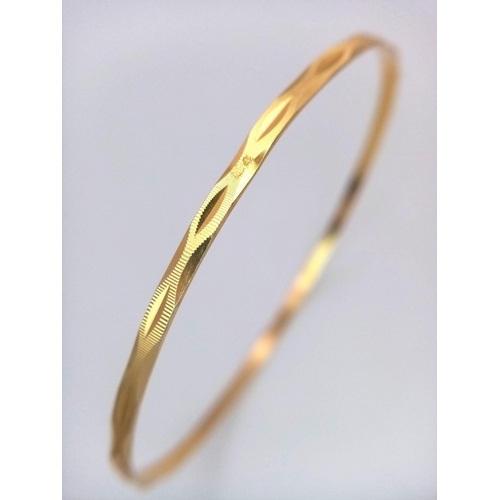 640 - A 9K Yellow Gold Thin Bangle. 3mm width. 6.5cm inner diameter. 5.75g weight.