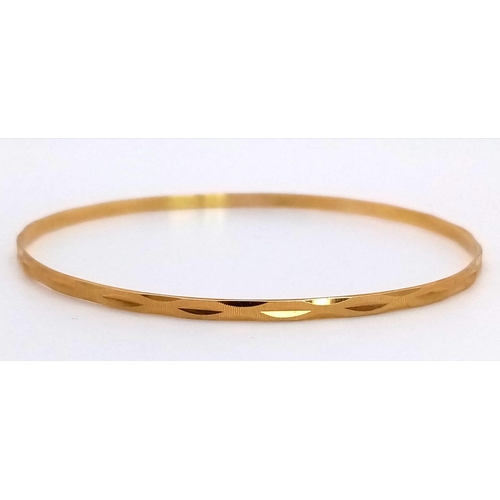 640 - A 9K Yellow Gold Thin Bangle. 3mm width. 6.5cm inner diameter. 5.75g weight.